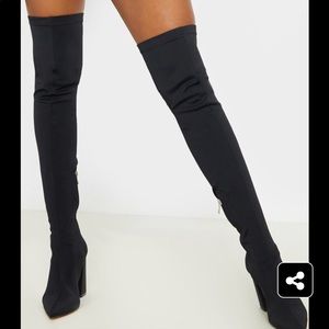 Thigh high black boots